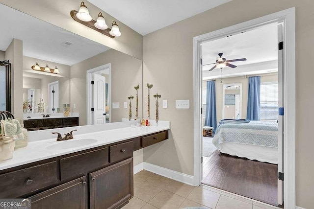 bathroom with ceiling fan, vanity, and tile patterned floors