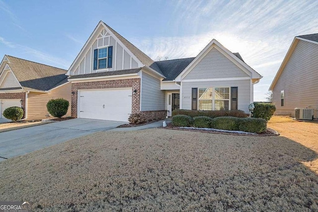 view of front of property featuring central AC unit and a garage