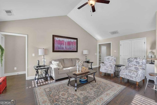 living room featuring lofted ceiling, dark wood-type flooring, and ceiling fan