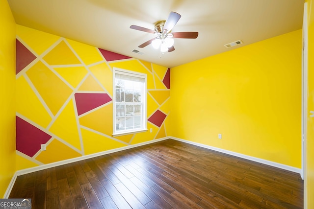 spare room with ceiling fan and hardwood / wood-style flooring