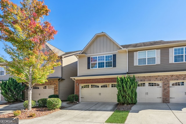 multi unit property featuring a garage