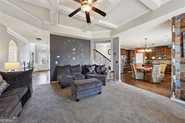 carpeted living room featuring coffered ceiling, ceiling fan, and beamed ceiling