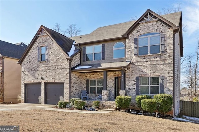 view of front of house featuring a garage and covered porch