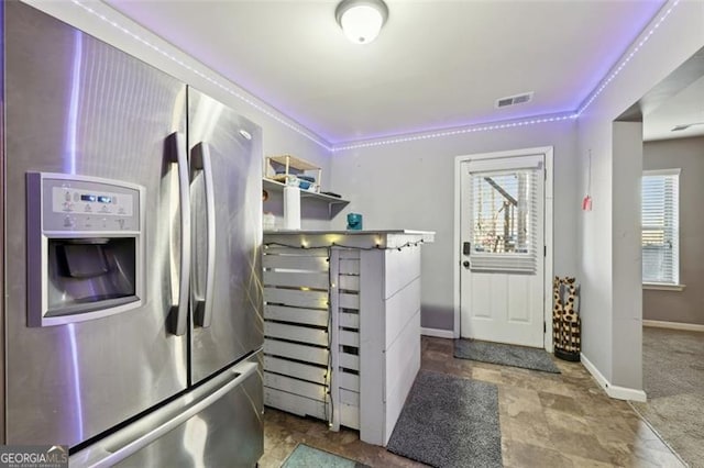 interior space featuring stainless steel fridge