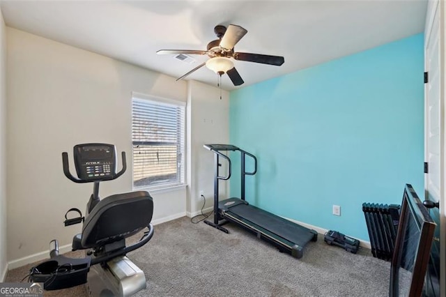 workout area featuring carpet flooring and ceiling fan