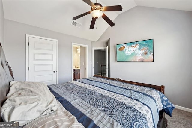 bedroom featuring ensuite bathroom, carpet, lofted ceiling, ceiling fan, and a closet