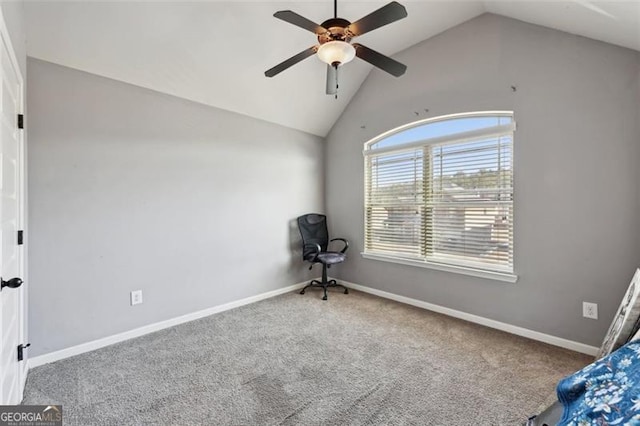 unfurnished bedroom with ceiling fan, vaulted ceiling, and carpet flooring