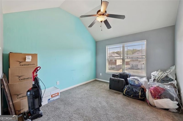 misc room featuring carpet floors, ceiling fan, and vaulted ceiling