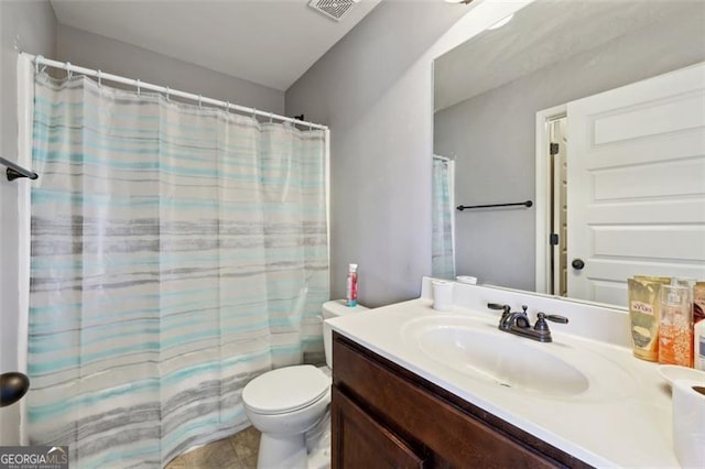 bathroom with toilet and vanity