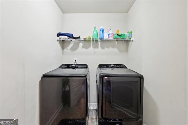 washroom with washer and dryer