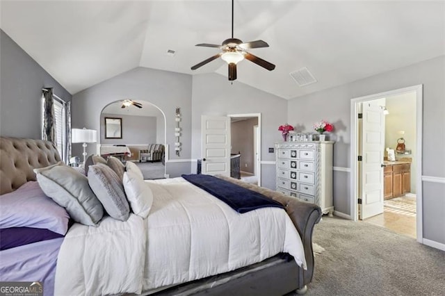 bedroom featuring lofted ceiling, carpet floors, ceiling fan, and connected bathroom