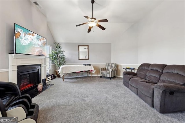 living room with lofted ceiling, carpet floors, and ceiling fan