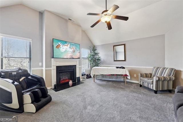 carpeted bedroom featuring ceiling fan and vaulted ceiling