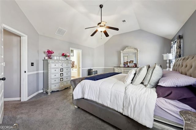 carpeted bedroom featuring lofted ceiling, ensuite bathroom, and ceiling fan