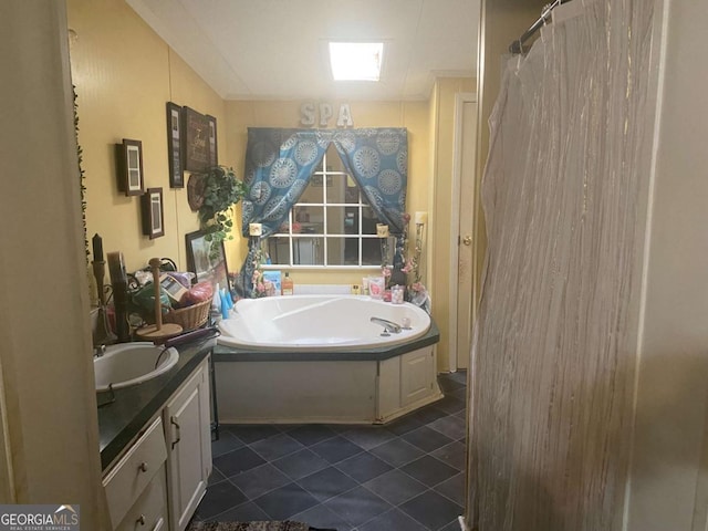 bathroom featuring a bath and vanity