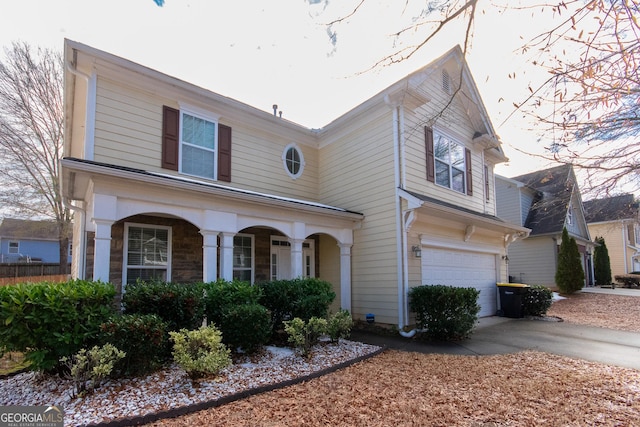 view of front of home with a porch and a garage