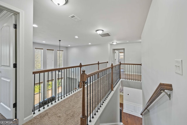 corridor with carpet flooring