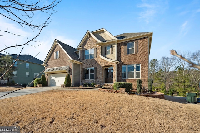 view of front of home with a front yard and a garage