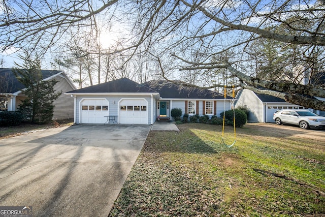 single story home featuring a garage and a front lawn