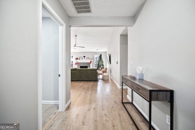 hallway featuring light wood-type flooring