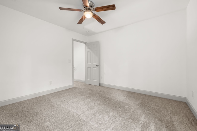 carpeted empty room with ceiling fan