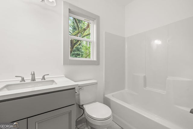 bathroom with toilet and vanity