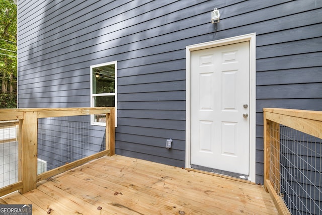 entrance to property featuring a deck