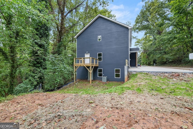 rear view of property with central air condition unit