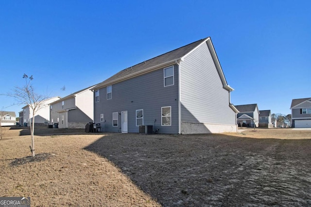 rear view of house with cooling unit