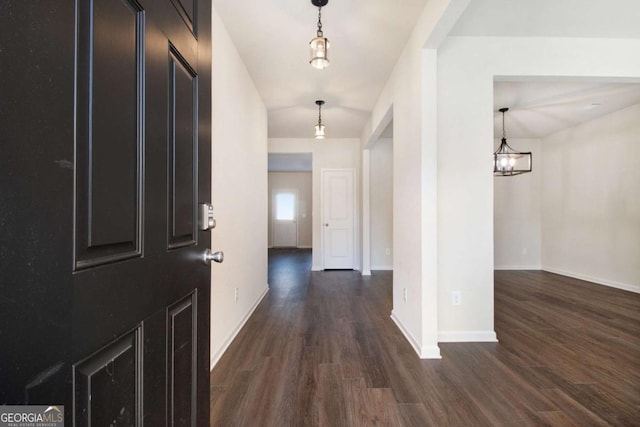 corridor with dark hardwood / wood-style floors