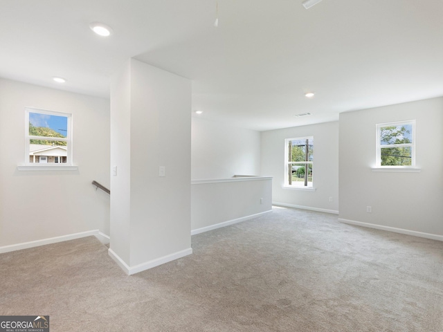 unfurnished room featuring carpet, baseboards, and recessed lighting