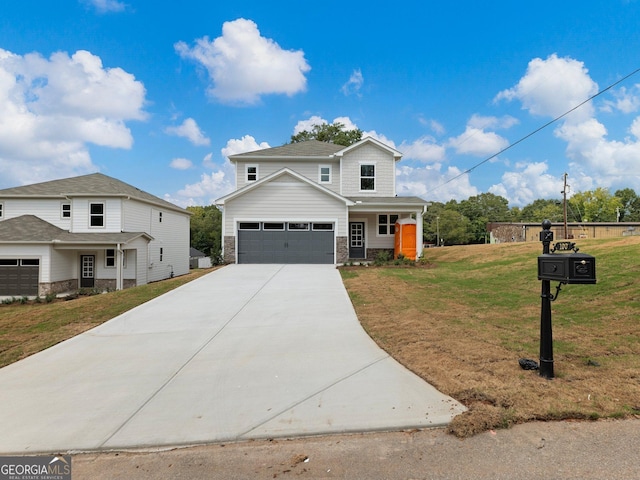 traditional-style house featuring a garage, a front yard, stone siding, and concrete driveway