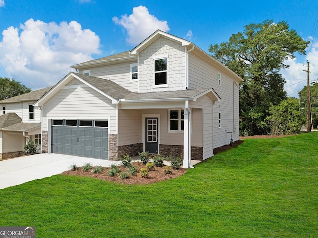 view of front facade featuring stone siding, an attached garage, driveway, and a front yard