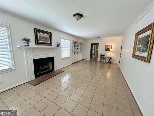 unfurnished living room featuring built in shelves, ornamental molding, light tile patterned floors, and plenty of natural light