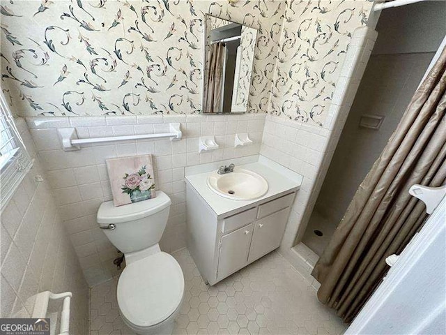 bathroom featuring tile walls, walk in shower, tile patterned flooring, and toilet