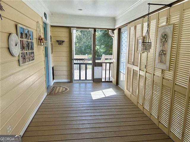 unfurnished sunroom featuring a wealth of natural light