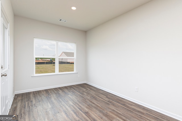 unfurnished room featuring dark hardwood / wood-style floors