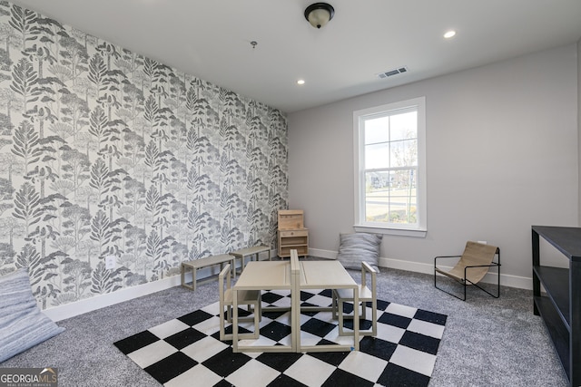 sitting room featuring carpet floors