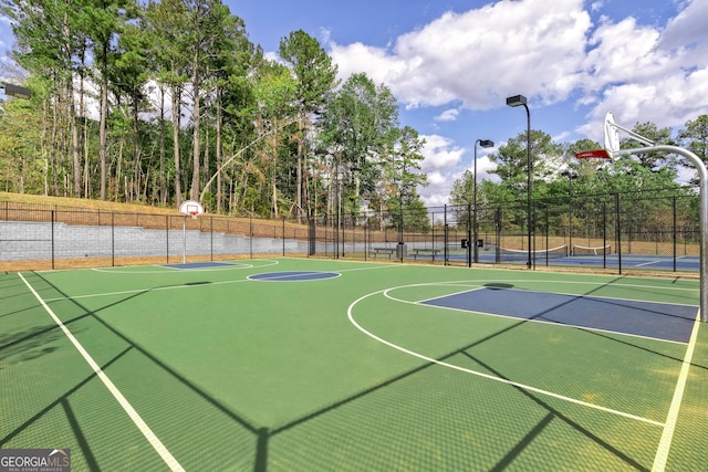 view of basketball court with tennis court