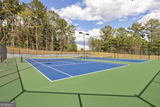 view of sport court featuring basketball hoop