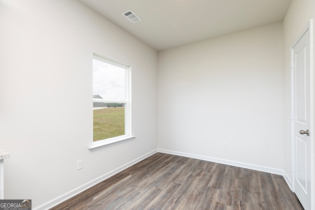 unfurnished room featuring dark hardwood / wood-style flooring