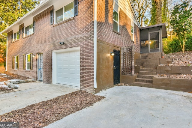 view of side of home with a garage