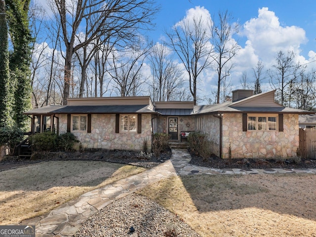 ranch-style house with a front lawn