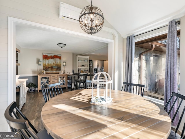 dining space with lofted ceiling, dark wood-type flooring, a wall mounted air conditioner, and an inviting chandelier