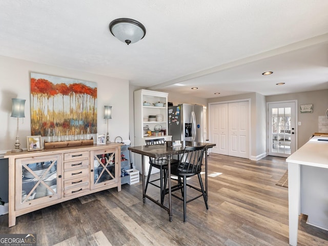 dining room with dark wood-type flooring