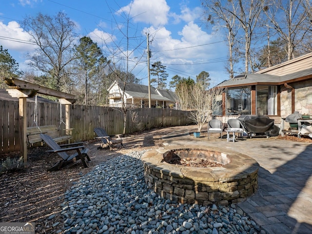 view of yard featuring a patio area and a fire pit