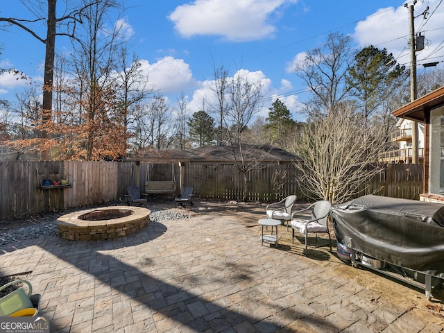 view of patio / terrace featuring area for grilling and an outdoor fire pit