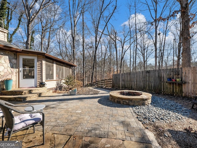 view of patio / terrace with an outdoor fire pit