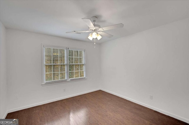 spare room featuring ceiling fan and hardwood / wood-style flooring