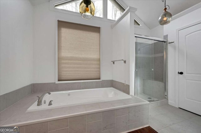 bathroom with lofted ceiling and separate shower and tub